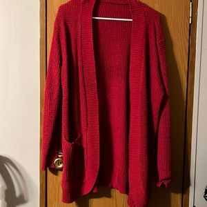 Red cardigan. Unsure of the brand